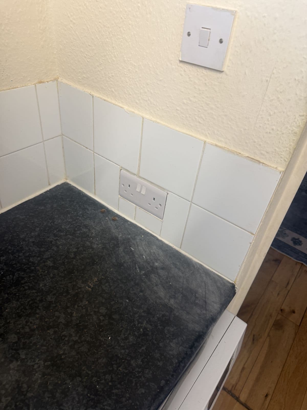 Kitchen worktop cleared right back to the tiles so we can get to the sockets and switches - preparing a home for a house rewire