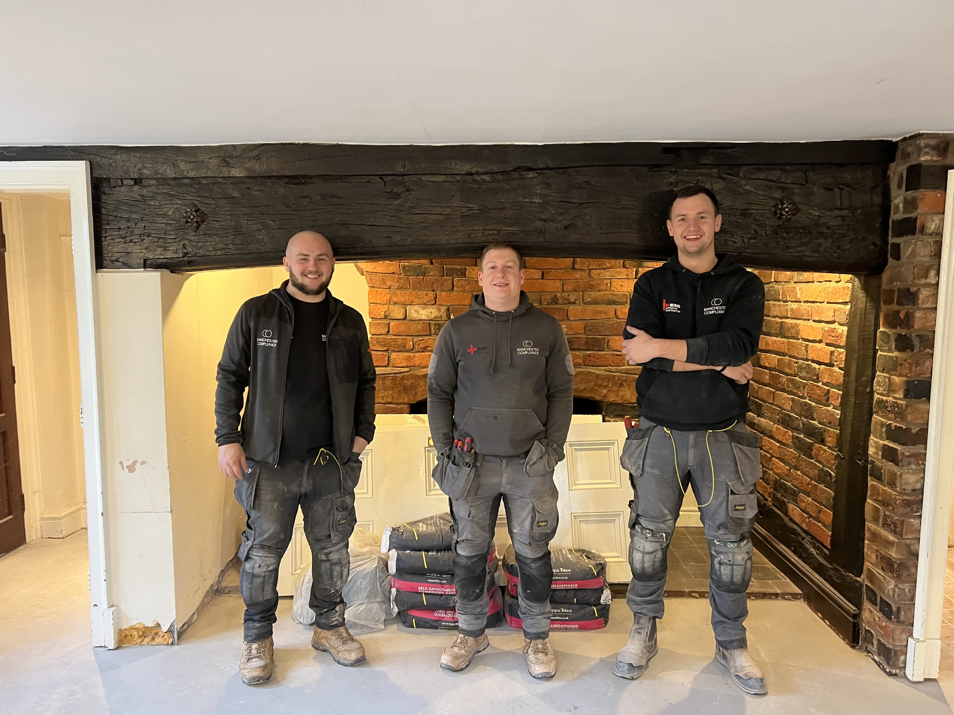 Manchester Compliance rewiring team on site at a property